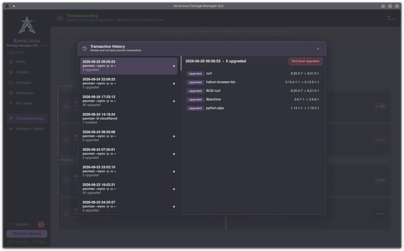 Transaction History panel showing dated pacman upgrade entries with Roll back upgrades button